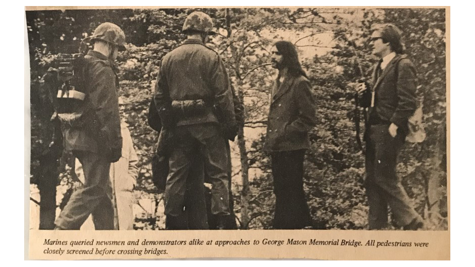 The Quantico Sentry newspaper caption reads: “Marines queried newsmen and demonstrators alike at approaches to George Mason Memorial Bridge. All pedestrians were closely screened before crossing bridges.”