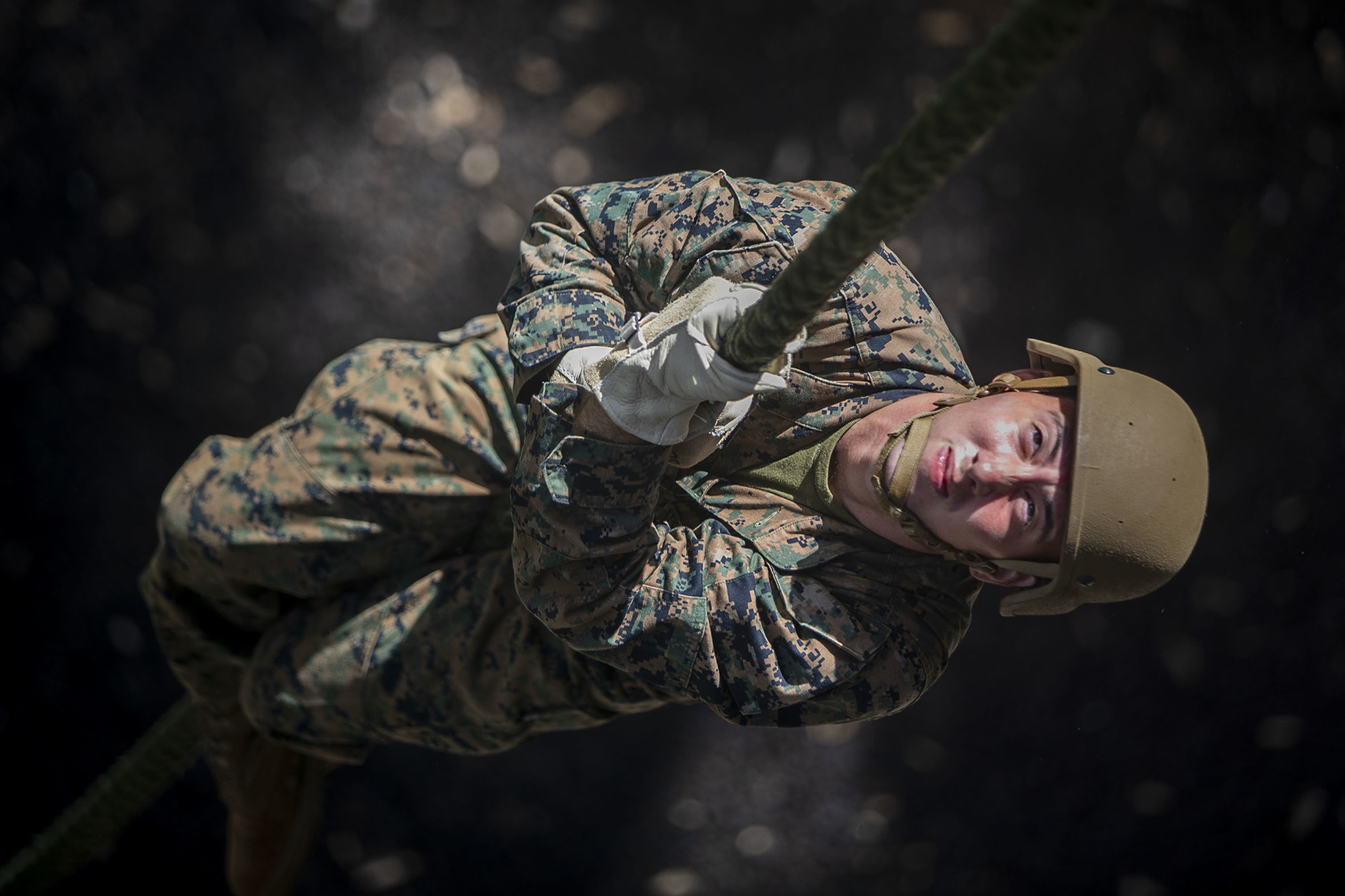 Marine Corps Lance. Cpl. Jonathen Figueroa conducts a fast roping exercise at the Lightning Academy, East Range Training Complex, Hawaii, Aug. 11, 2020.