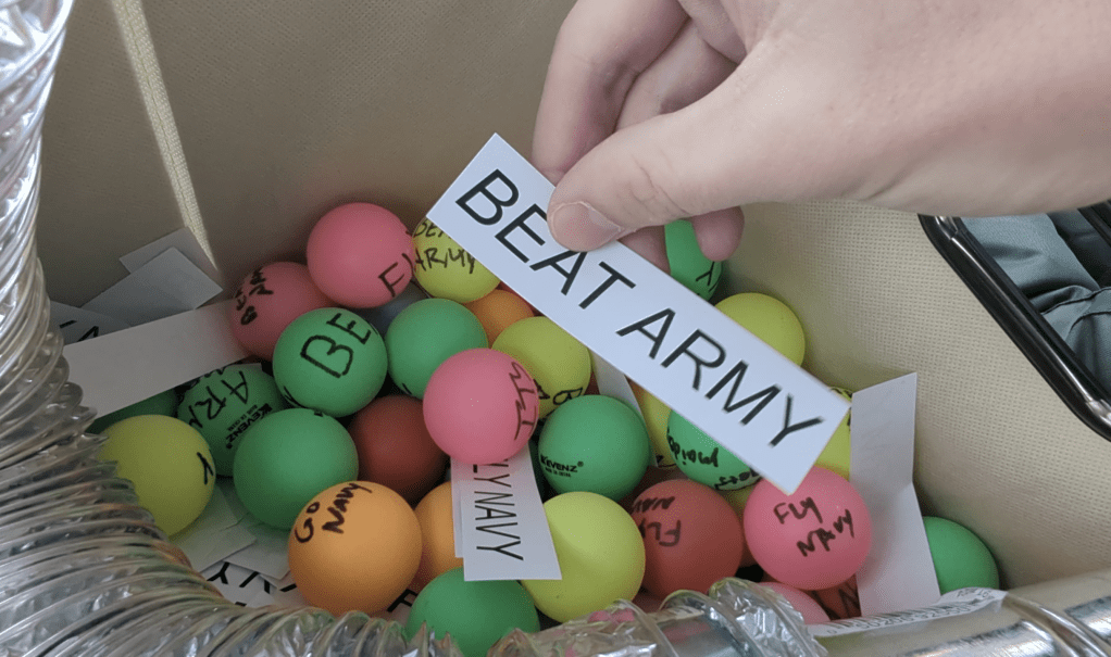 Midshipmen drop leaflets, Ping-Pong balls on cadets ahead of big game