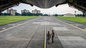 On the ground at Yokota Air Base, the Air Force transport hub of the Pacific