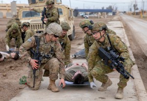US re-positioning some troops from smaller bases in Iraq following deadly rocket attack