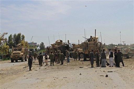 Bombings, including attack on U.S. troops, kills 13 Afghans