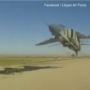 Libyan plane mere feet off the ground seems to narrowly miss man