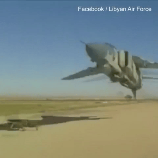 Libyan plane mere feet off the ground seems to narrowly miss man