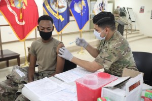 Lawmakers call on Biden to make COVID vaccines mandatory for the military