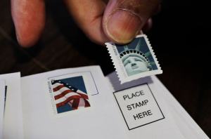 Postal Service bets on higher stamp prices to fix woes
