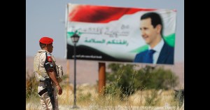 Kurds meet with Syrian government to discuss self-rule as Assad demands US troops withdraw