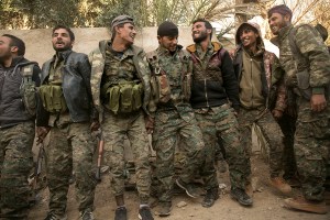 US-backed forces seize ISIS camp in Syria, while assault on last village held by militants continues