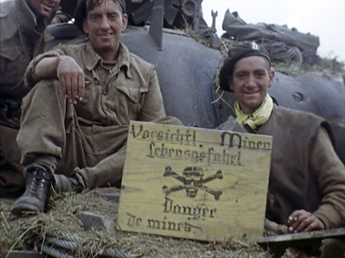 Soldiers sit on a tank