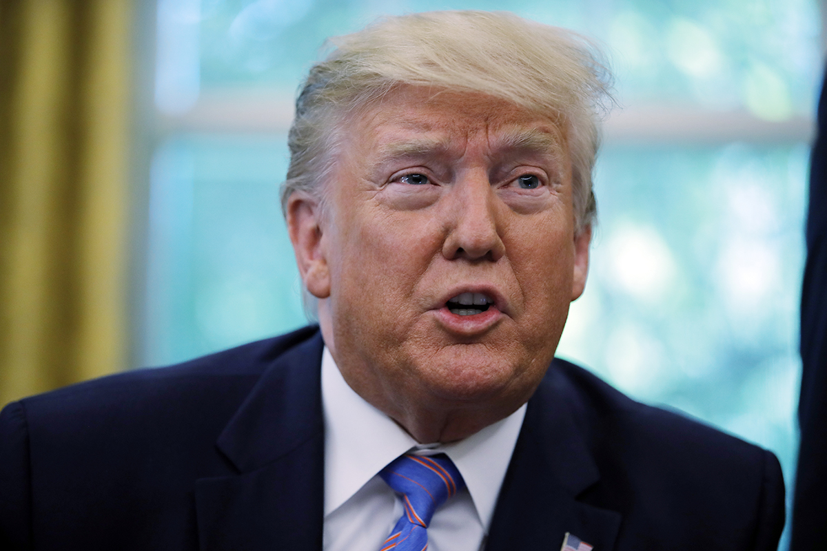 President Donald Trump talks during a signing ceremony in the Oval Office of the White House in Washington on July 1, 2019.