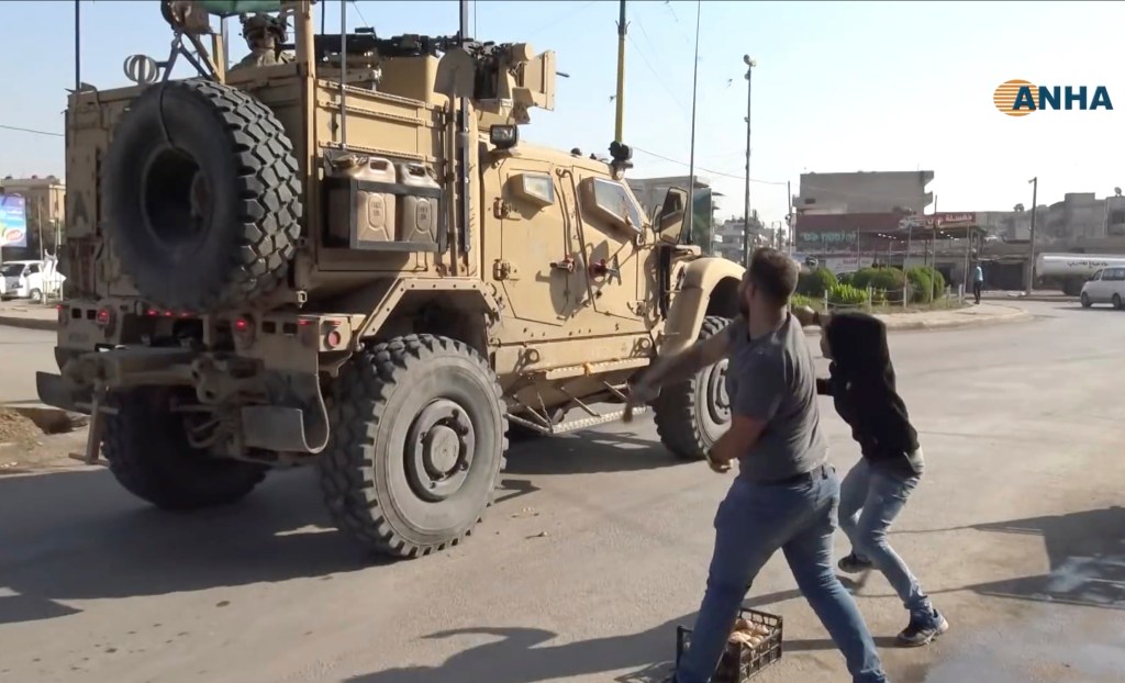 US military convoy withdrawing from Syria pelted with garbage by angry residents