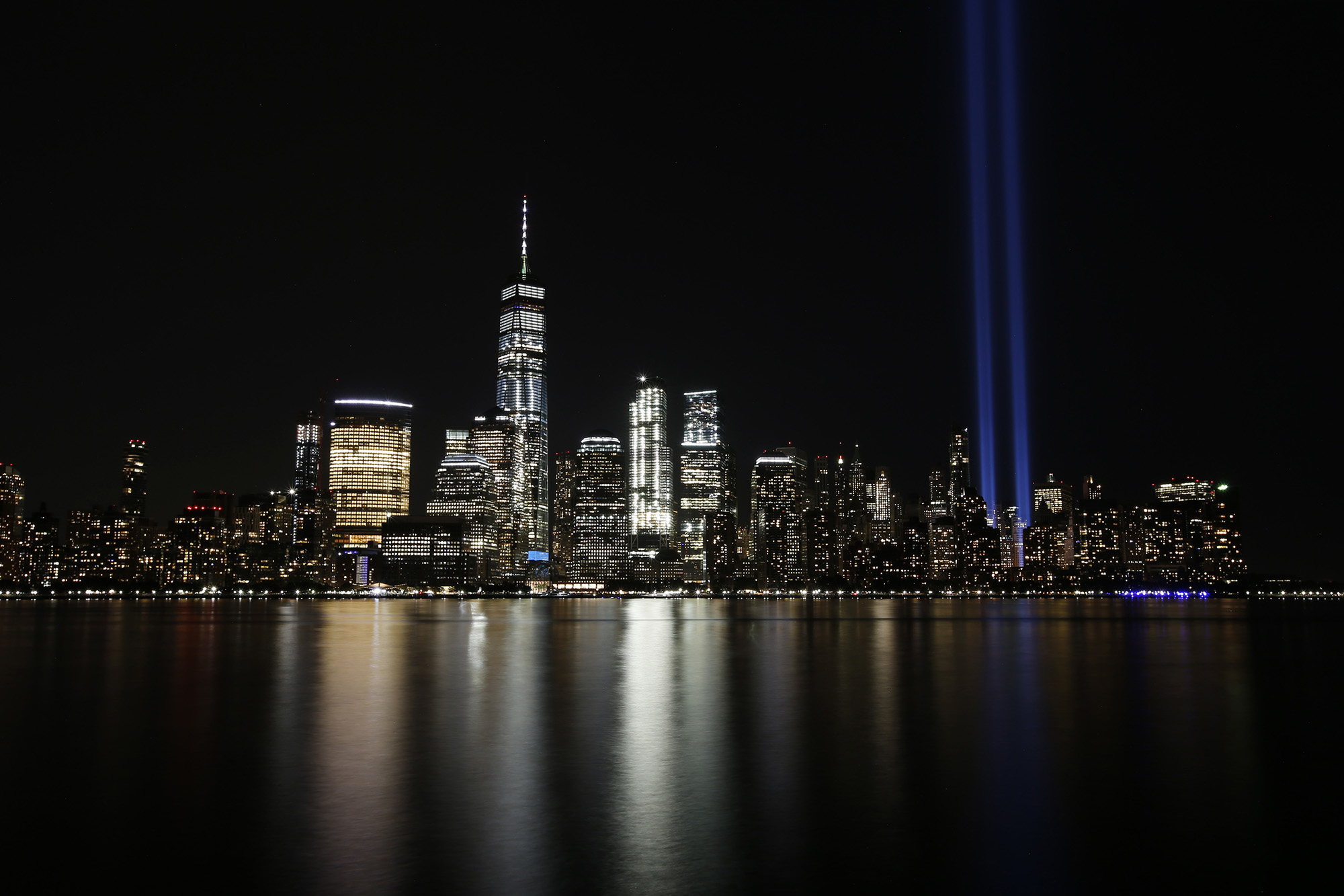 In this Sept. 11, 2017, file photo, the Tribute in Light illuminates in the sky above the Lower Manhattan area of New York, as seen from across the Hudson River in Jersey City, N.J.