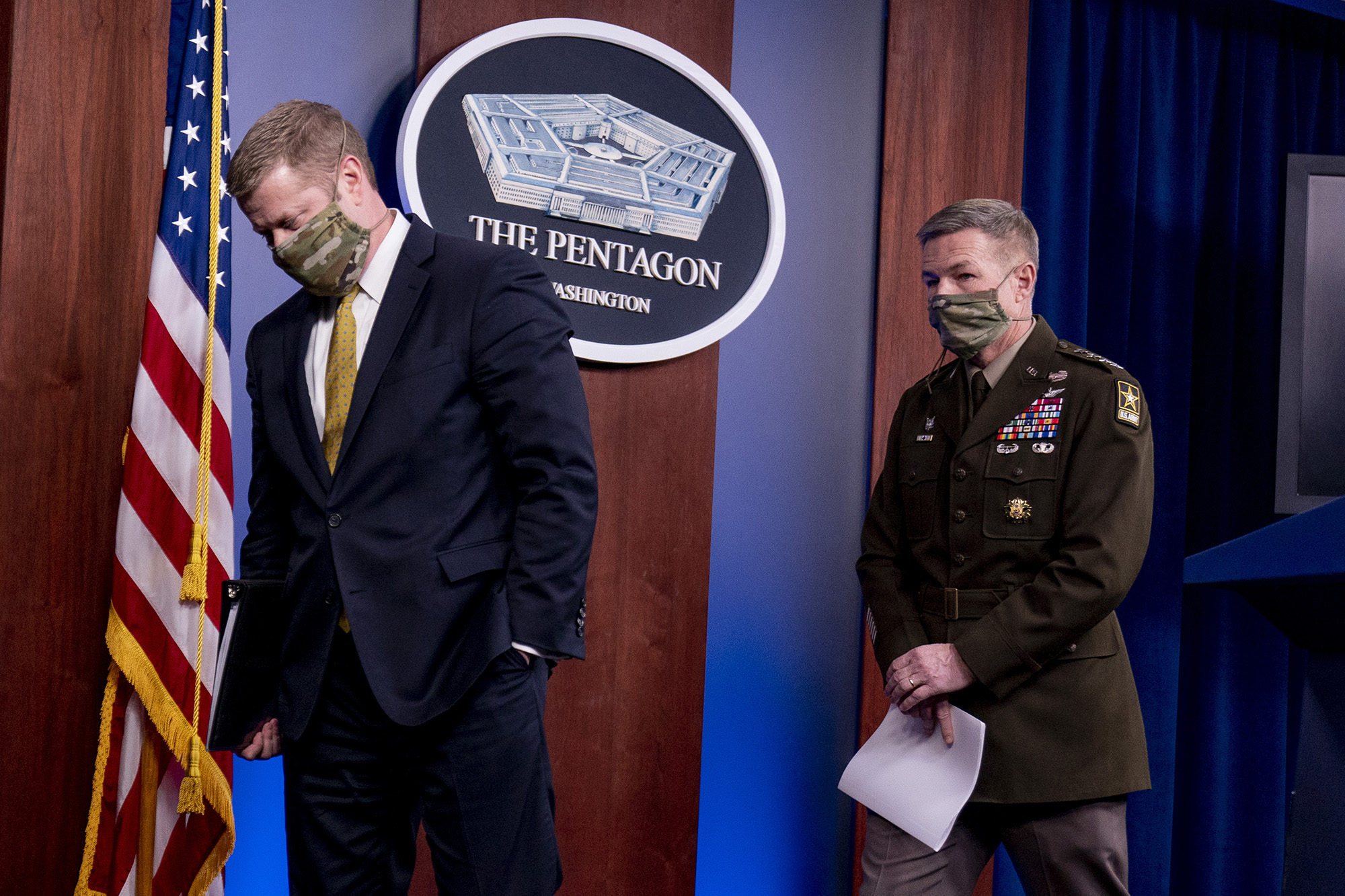 Secretary of the Army Ryan McCarthy, left, and Gen. James McConville, chief of staff of the Army, right, depart after speaking at a briefing on an investigation into Fort Hood, Texas, at the Pentagon, Tuesday, Dec. 8, 2020, in Washington.