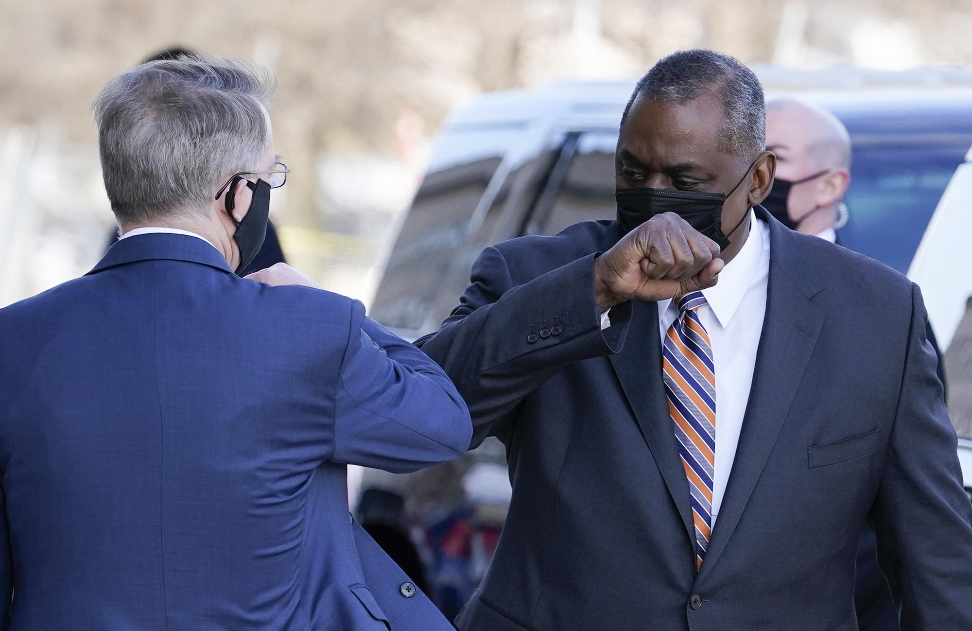 Defense Secretary Lloyd Austin, right, greets Deputy Secretary of Defense David Norquist as he arrives at the Pentagon on Jan. 22, 2021, in Washington.