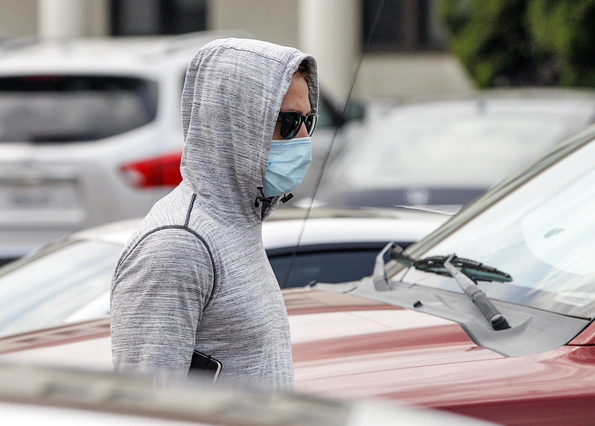 Petty Officer First Class Adel Enayat leaves the building after appearing for a hearing at Naval Base San Diego, Friday, Aug. 21, 2020, in San Diego.