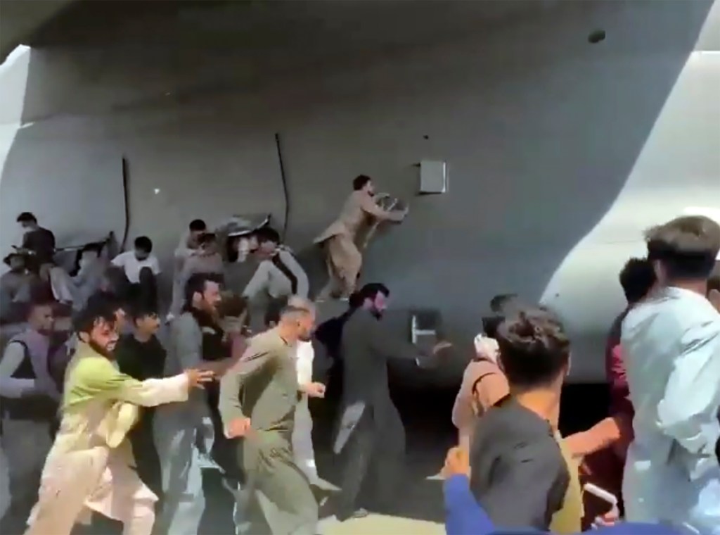 Kabul flights grounded as troops work to remove crowds from tarmac