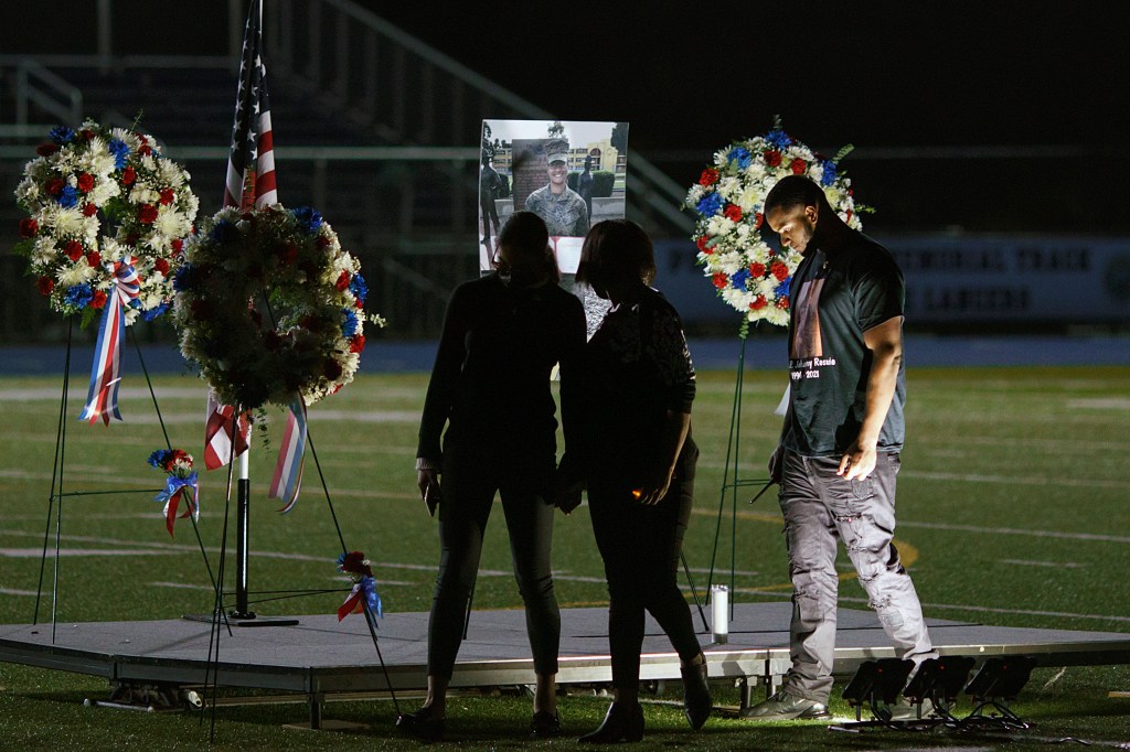 Here are photos from a vigil held for slain US Marine in her home city