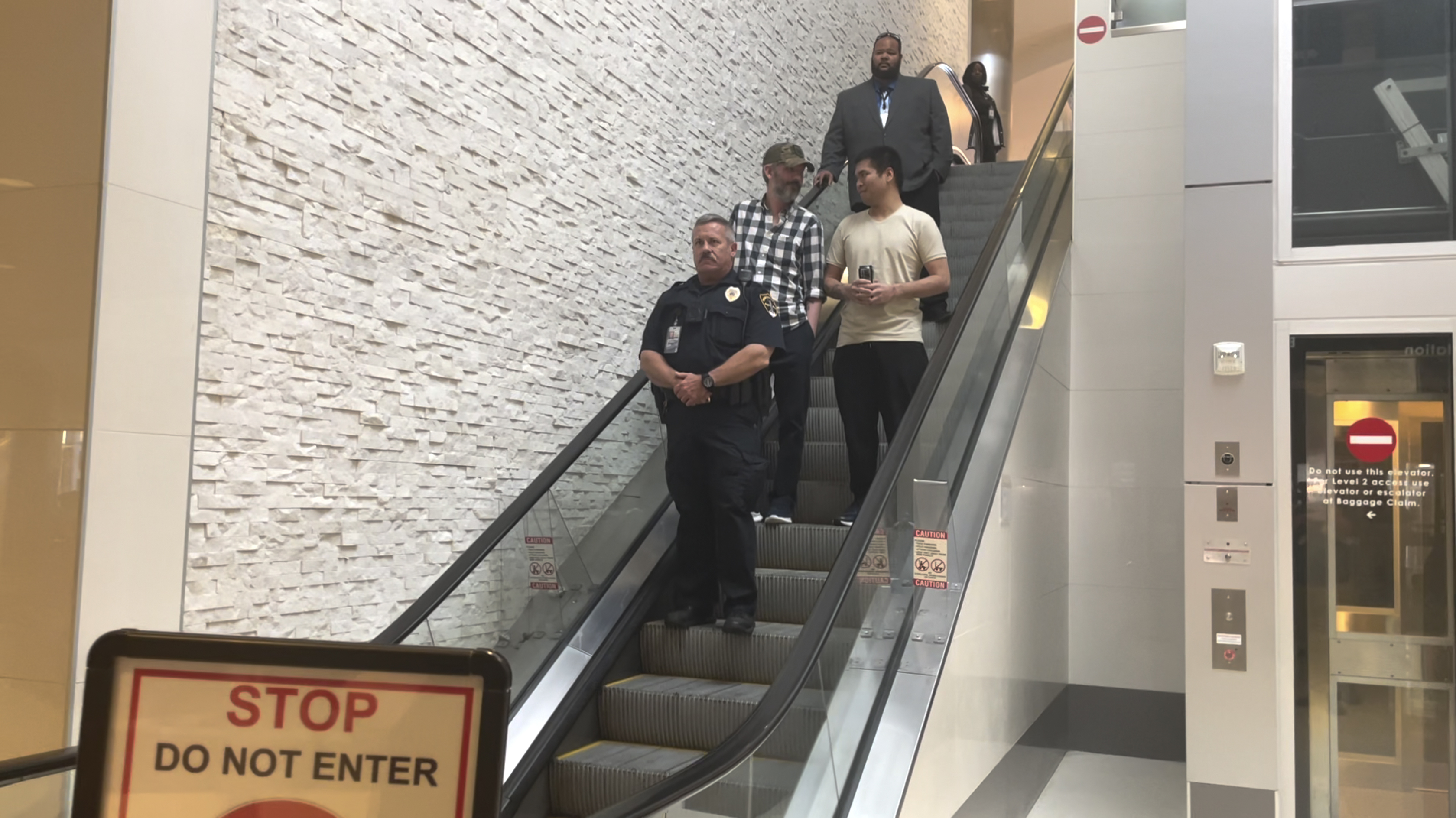 Andy Huynh, left, and Alex Drueke, right, are seen arriving at Birmingham-Shuttlesworth International Airport in Birmingham, Ala., Saturday, Sept. 24, 2022.