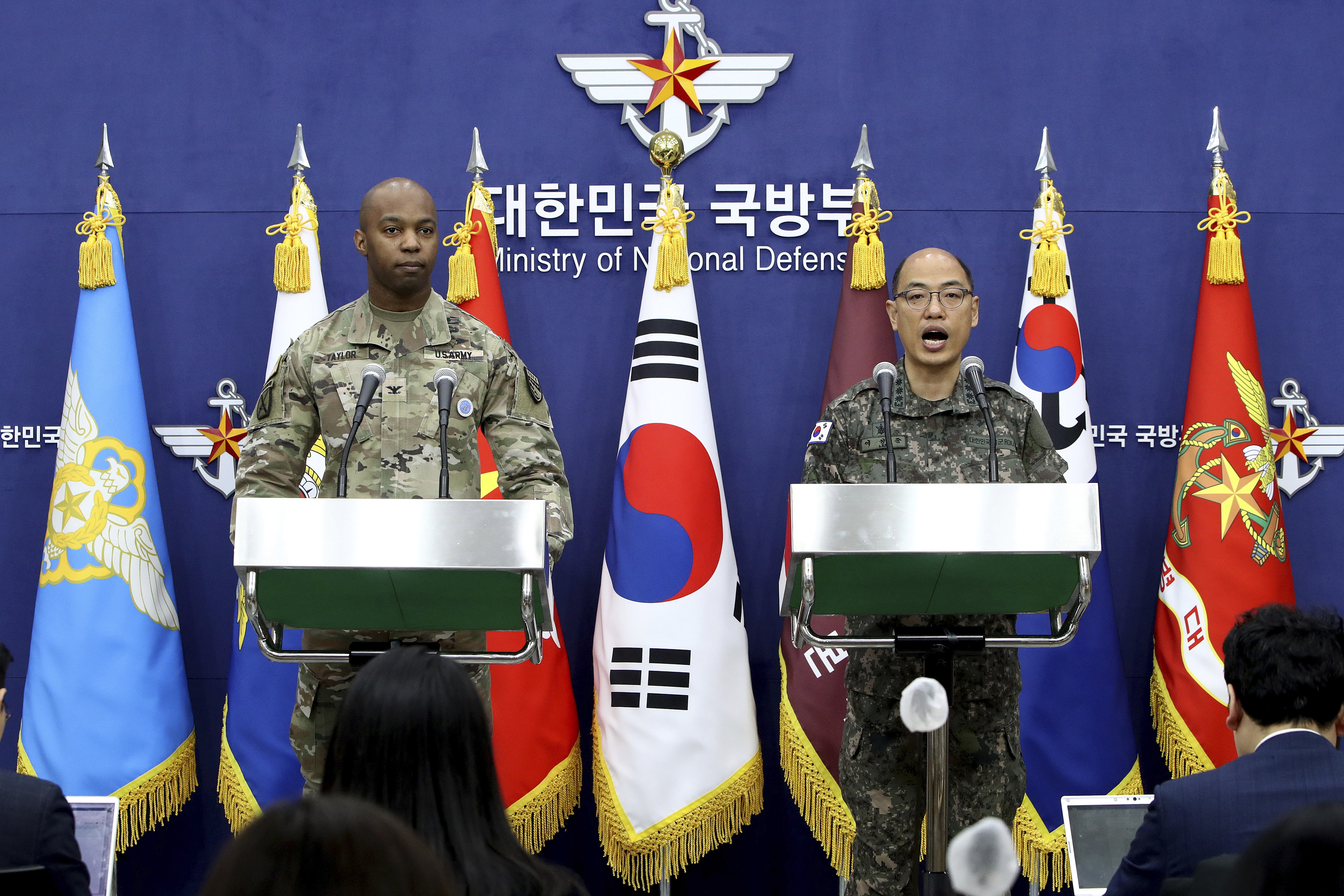 Col. Isaac Taylor, left, of the United Nations Command (UNC), Combined Forces Command (CFC), and United States Forces Korea (USFK) and Col. Lee Sung-jun of South Korea's Joint Chiefs of Staff attend the press briefing of the Freedom Shield Exercise at the Defense Ministry Friday, March 3, 2023 in Seoul, South Korea.