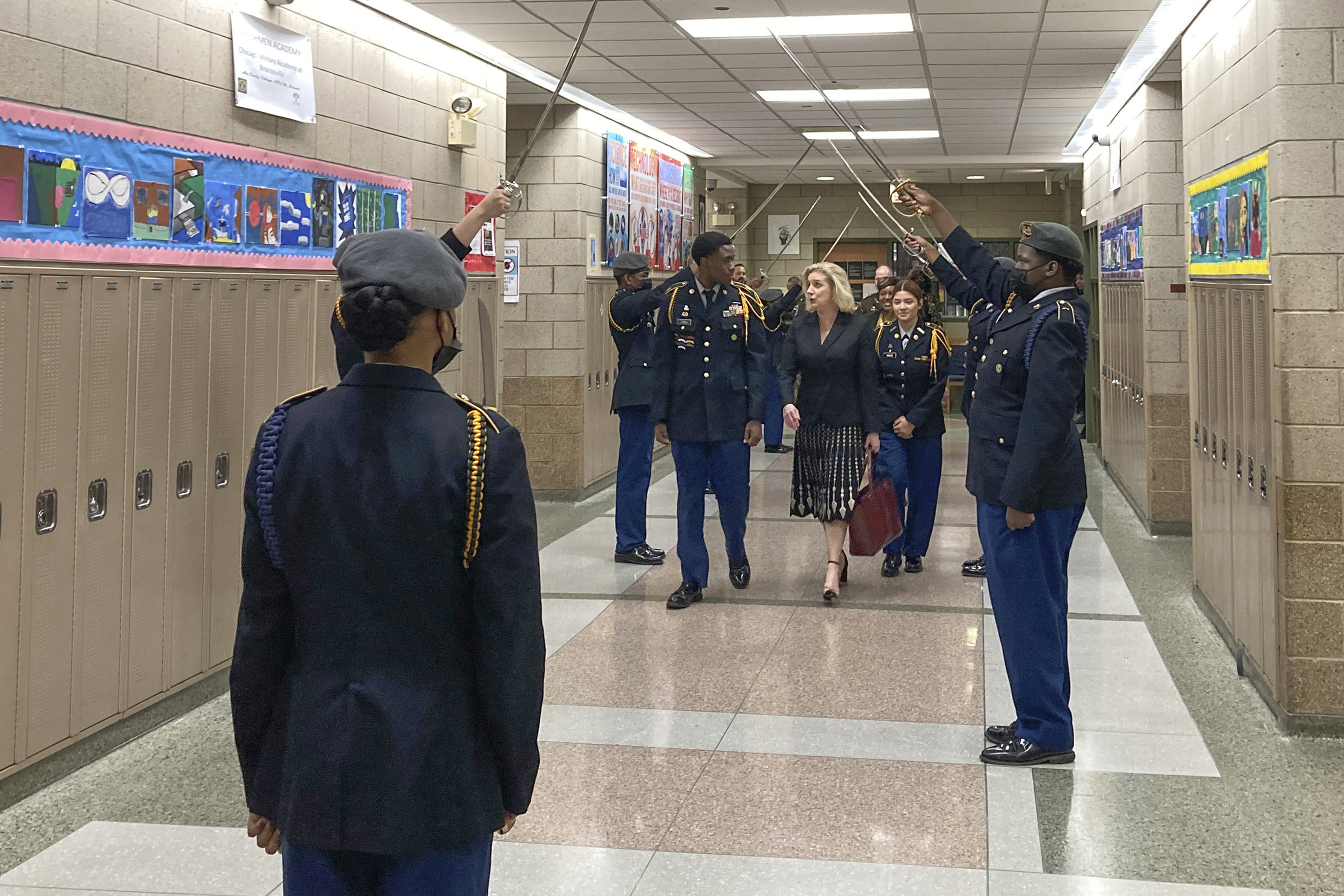 Army Secretary Christine Wormuth is greeted at the Chicago Military Academy as she heads into meetings with young members of the Reserve Officers' Training Corps in Chicago, on Feb. 15, 2023.