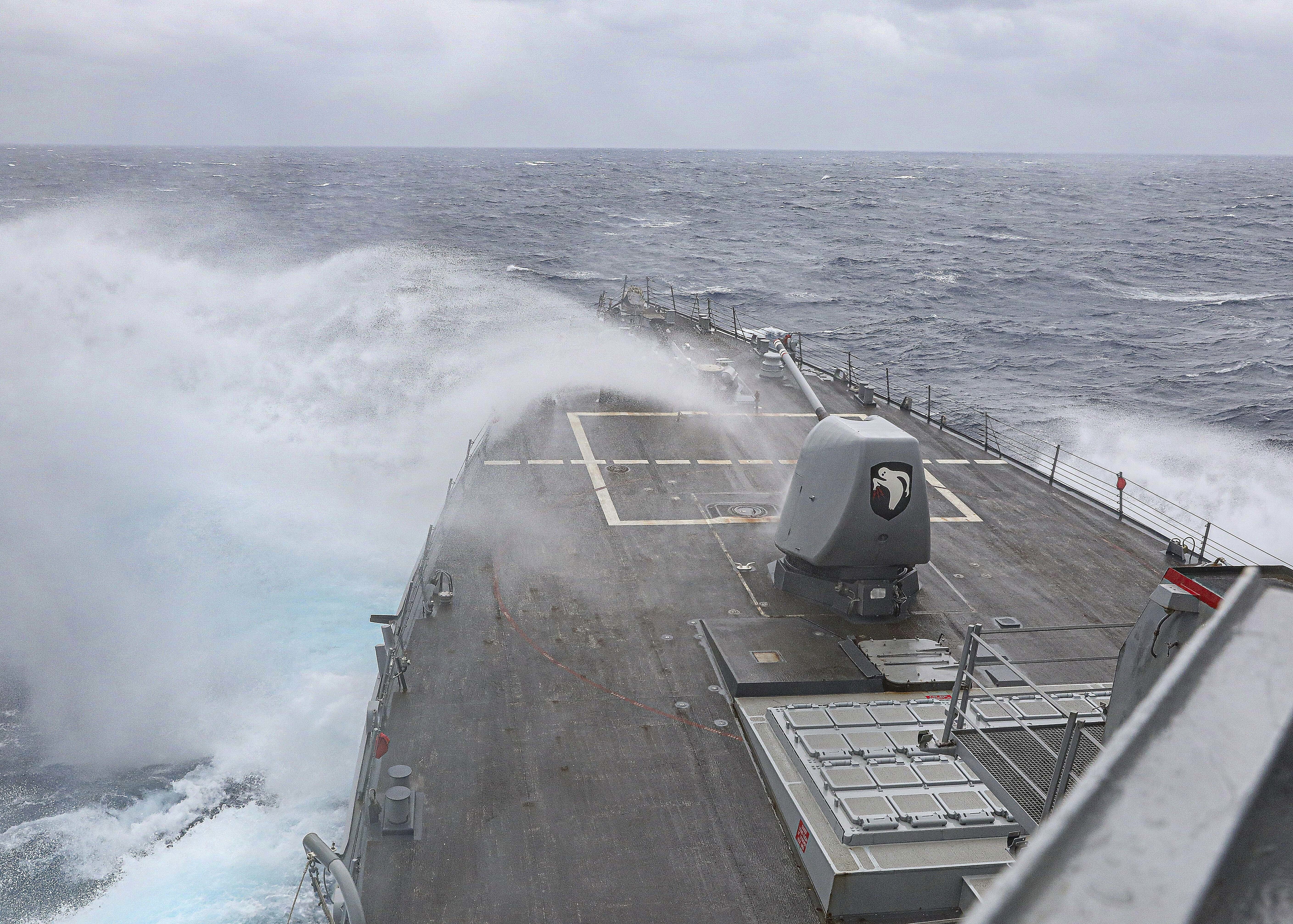 In this photo provided by the U.S. Navy, the Arleigh Burke-class guided-missile destroyer USS Milius steams in the Philippine Sea, on March 13, 2023.
