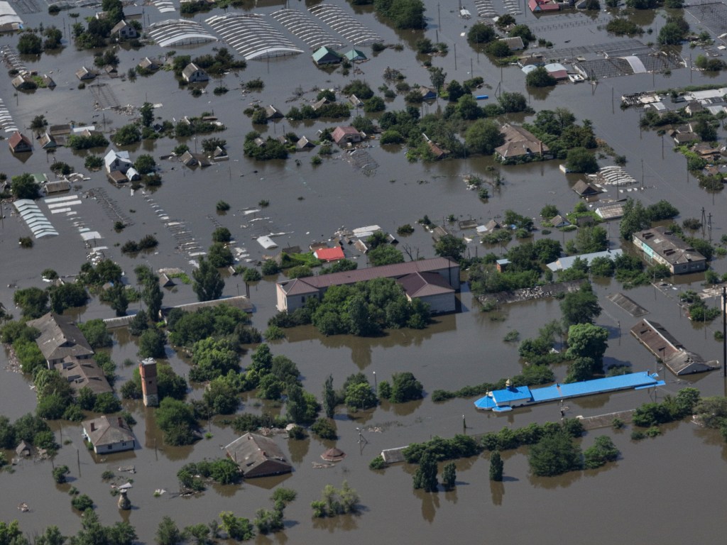 A dam collapses and thousands face the deluge — often with no help