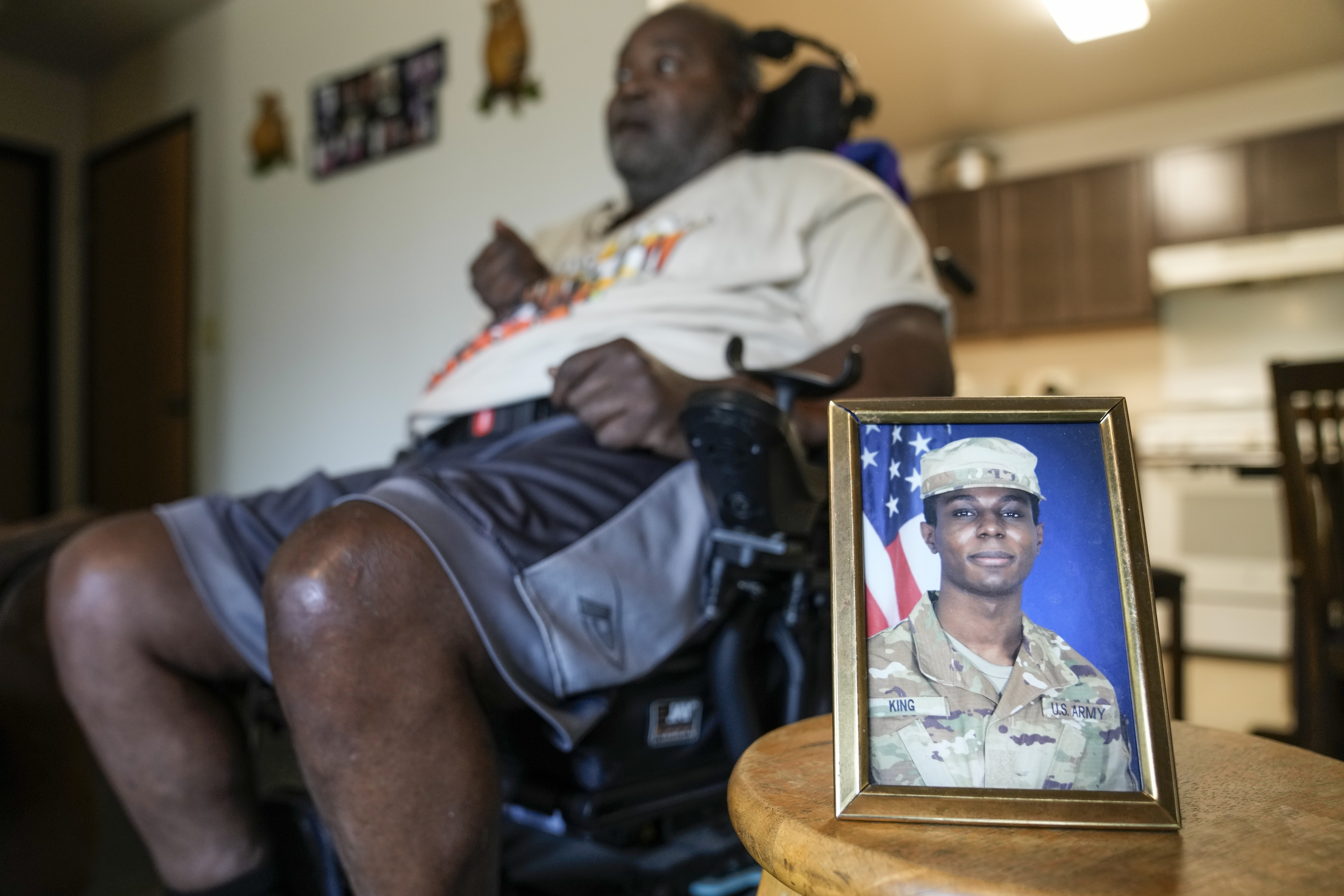 A portrait of American soldier Travis King is displayed as his grandfather, Carl Gates, talks about his grandson Wednesday, July 19, 2023, in Kenosha, Wis