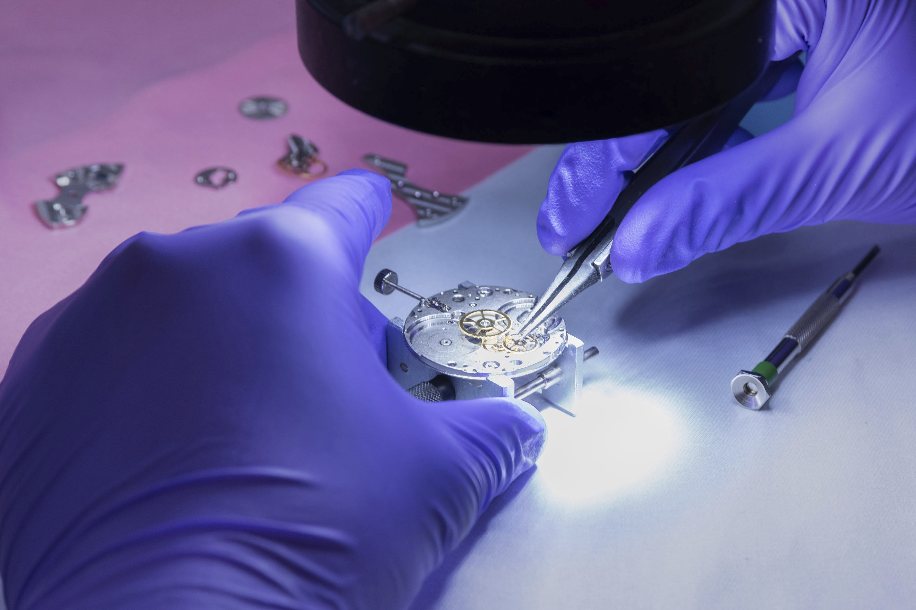 In this photo provided by Kansas City National Security Campus, an employee works on a mechanical wristwatch at the National Nuclear Security Administration's Kansas City facility in Kansas City, Mo., May 23, 2023.