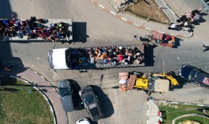 Palestinians in Gaza face choice: Stay home under airstrikes or flee?