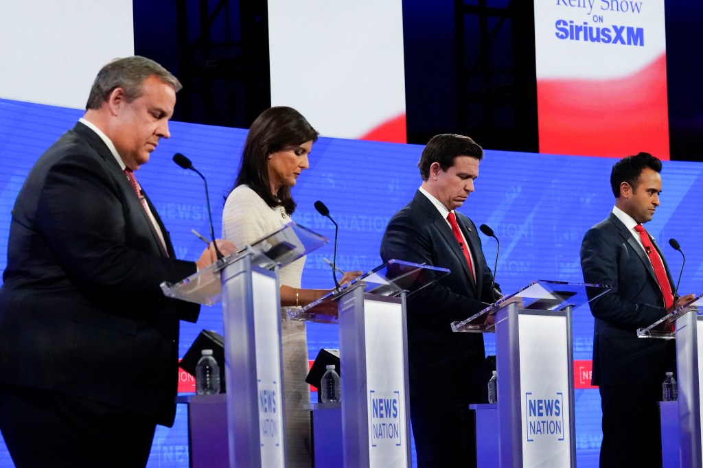 Republicans target government in lively fourth debate skipped by Trump