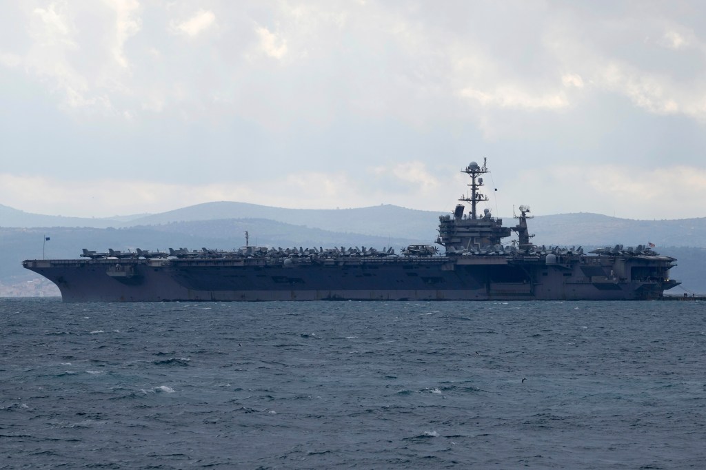 Fighter jet slips off carrier hangar deck in Red Sea, one minor injury