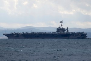 Fighter jet slips off carrier hangar deck in Red Sea, one minor injury