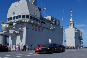 Man in Italian supercar chases world record atop aircraft carrier