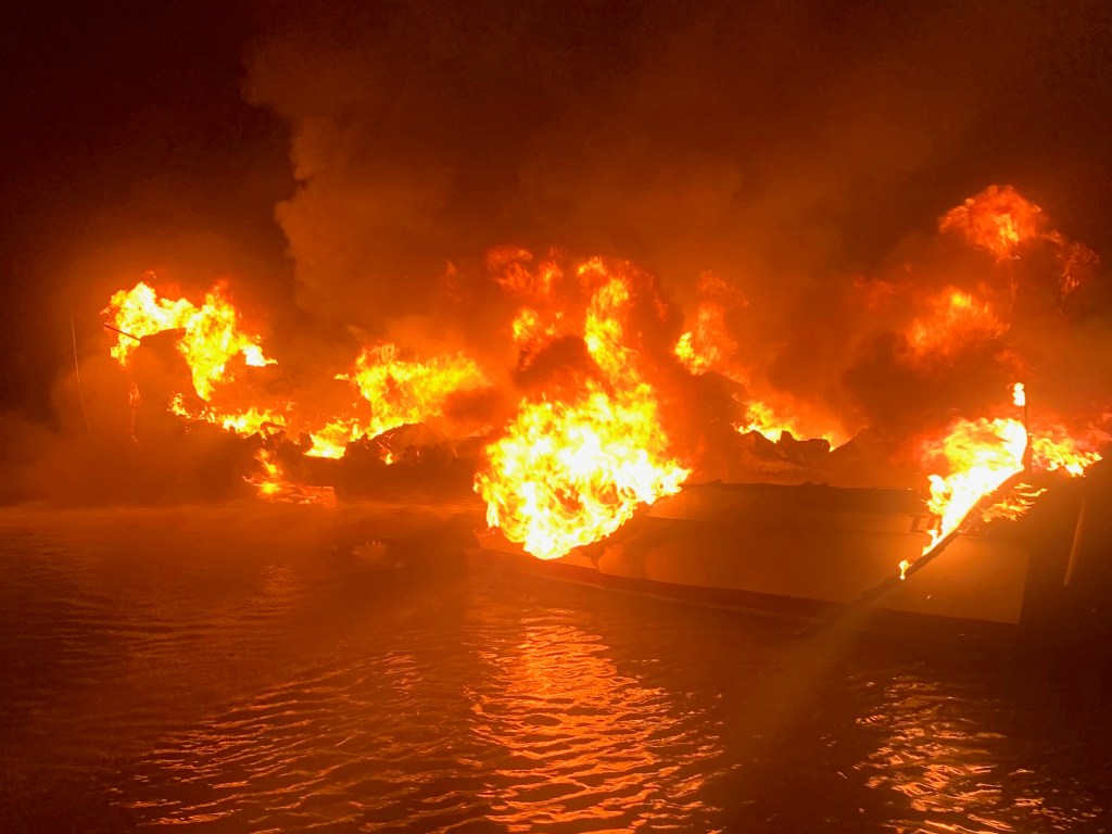 Coast Guard rescues 3 from boat blaze