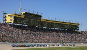 Old Glory and checkered flags — soldiers reenlist before NASCAR race