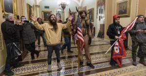 ‘QAnon Shaman’ charged with storming the Capitol is a Navy veteran