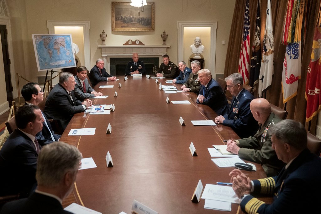 Masks are the uniform of the day for the rank-and-file — why aren’t the brass following suit?