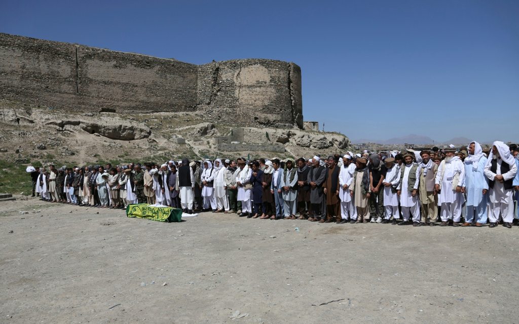 Afghans mourn, a day after massive truck bombing killed 90