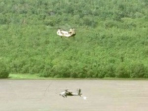 Chinook rescues stuck Apache from muddy Texas field