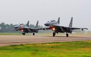 Chinese fighters buzz Air Force plane over East China Sea