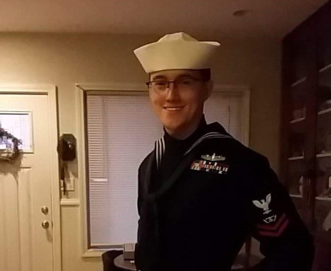 Navy identifies missing sailor from the cruiser Normandy as search continues