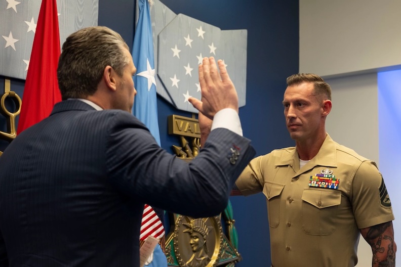 Veteran who lost both of his legs in combat reenlists in the Marine Corps