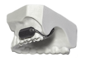 This new wireless communication device fits on your teeth