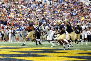 Navy defeats Fordham 52-16 despite injury to Smith